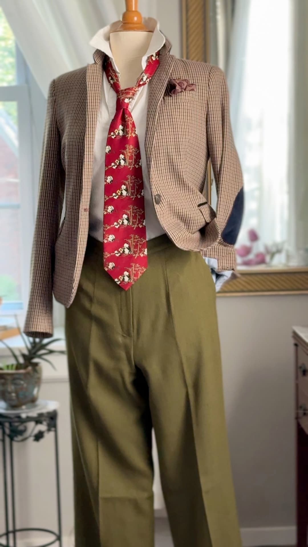 Vintage Giorgio Armani Cravatte tie in lacquer red, printed with pandas in a bamboo grove, styled over a white shirt and houndstooth jacket.