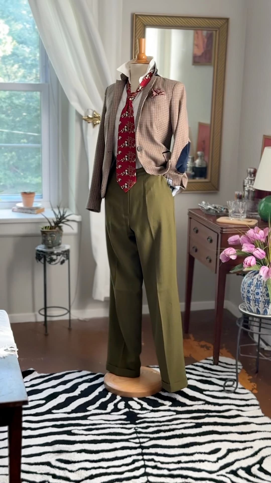 Vintage Giorgio Armani Cravatte tie in lacquer red, printed with pandas in a bamboo grove, styled over a white shirt and houndstooth jacket.