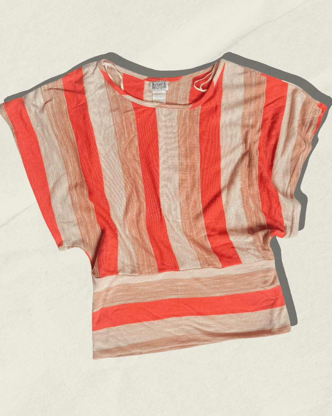 Vintage 70s Vamp striped knit top in coral, camel, and cream with dolman sleeves, shown flat.