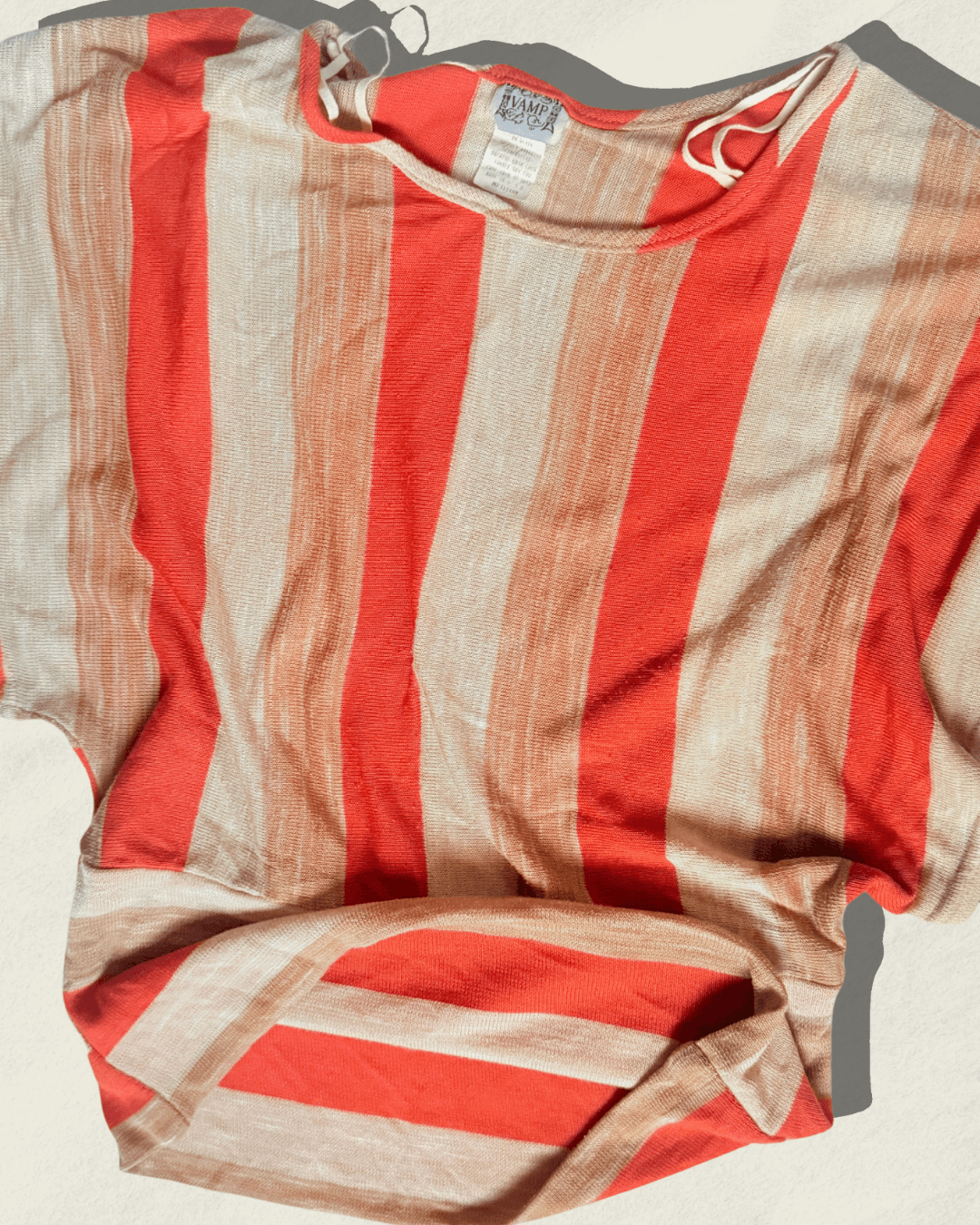 Vintage 70s Vamp striped knit top in coral, camel, and cream with dolman sleeves, shown flat.