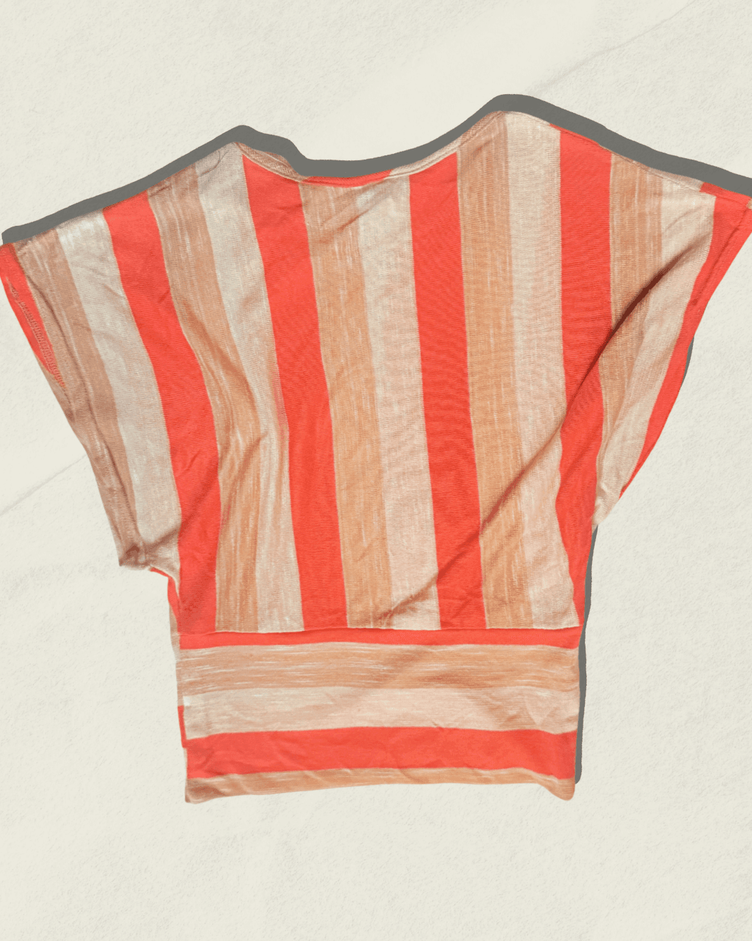 Vintage 70s Vamp striped knit top in coral, camel, and cream with dolman sleeves, shown flat.