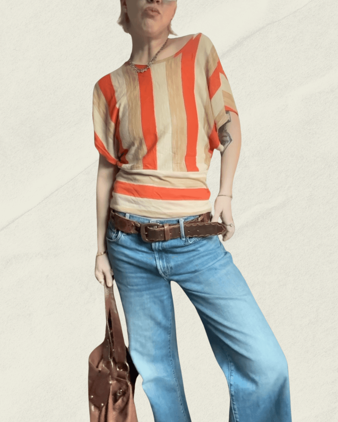 Vintage 70s Vamp striped knit top in coral, camel, and cream with dolman sleeves, shown flat.