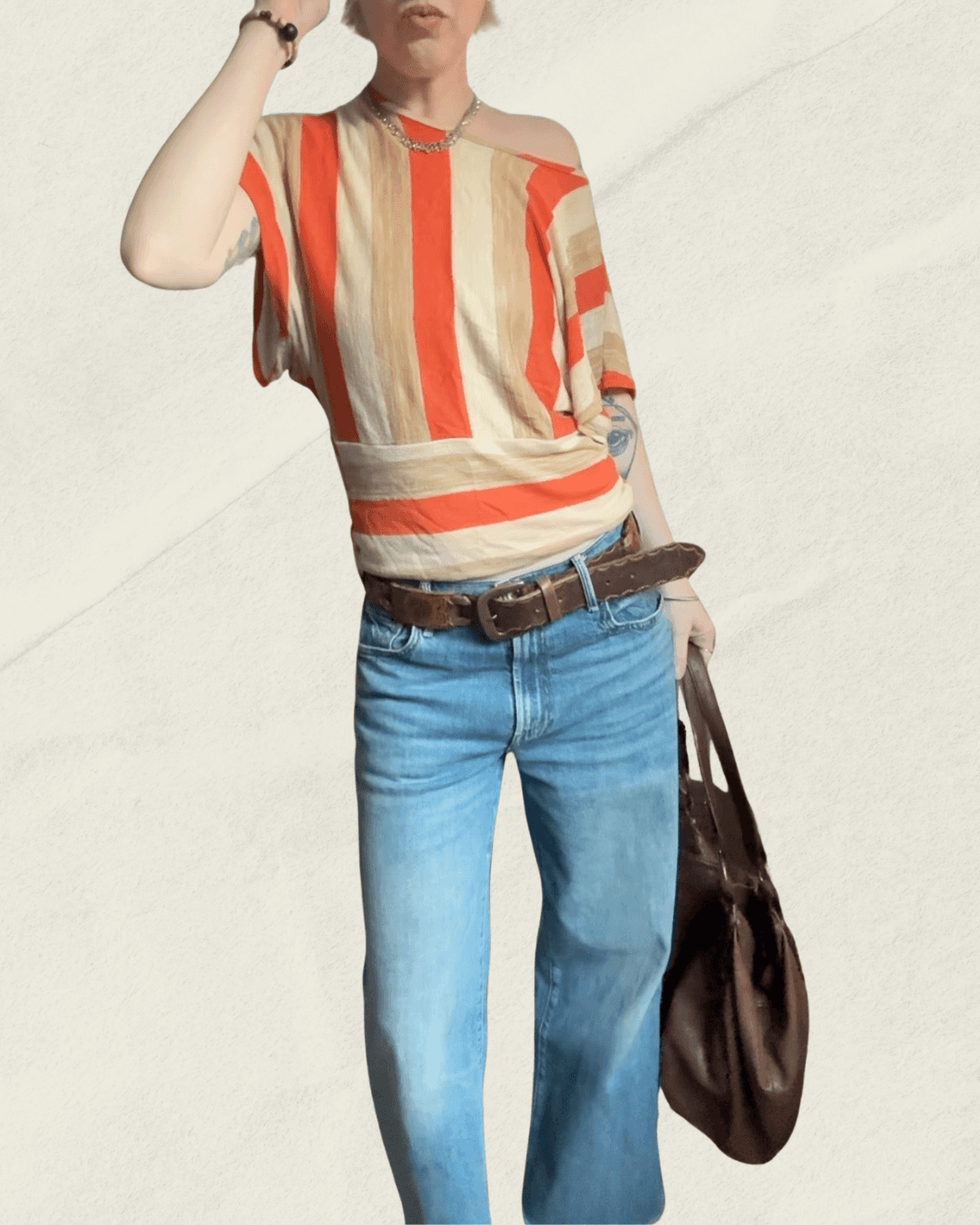 Vintage 70s Vamp striped knit top in coral, camel, and cream with dolman sleeves, shown flat.