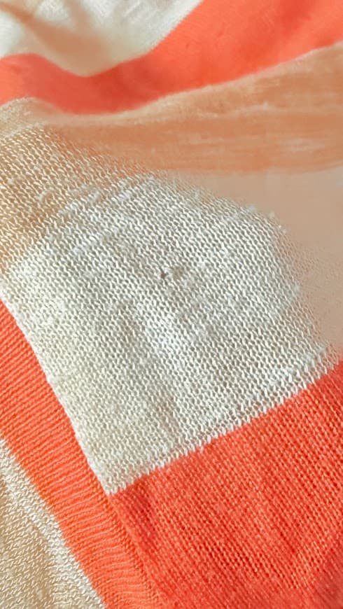 Vintage 70s Vamp striped knit top in coral, camel, and cream with dolman sleeves, shown flat.