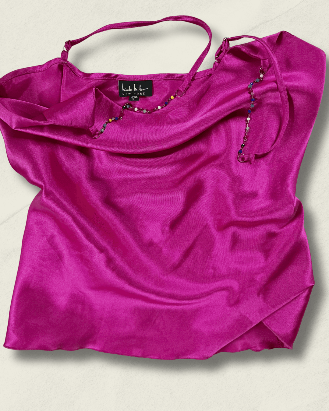 Y2K fuchsia Nicole Miller bias-cut silk camisole with multicolor hand-beaded straps and a draped neckline, shown flat.