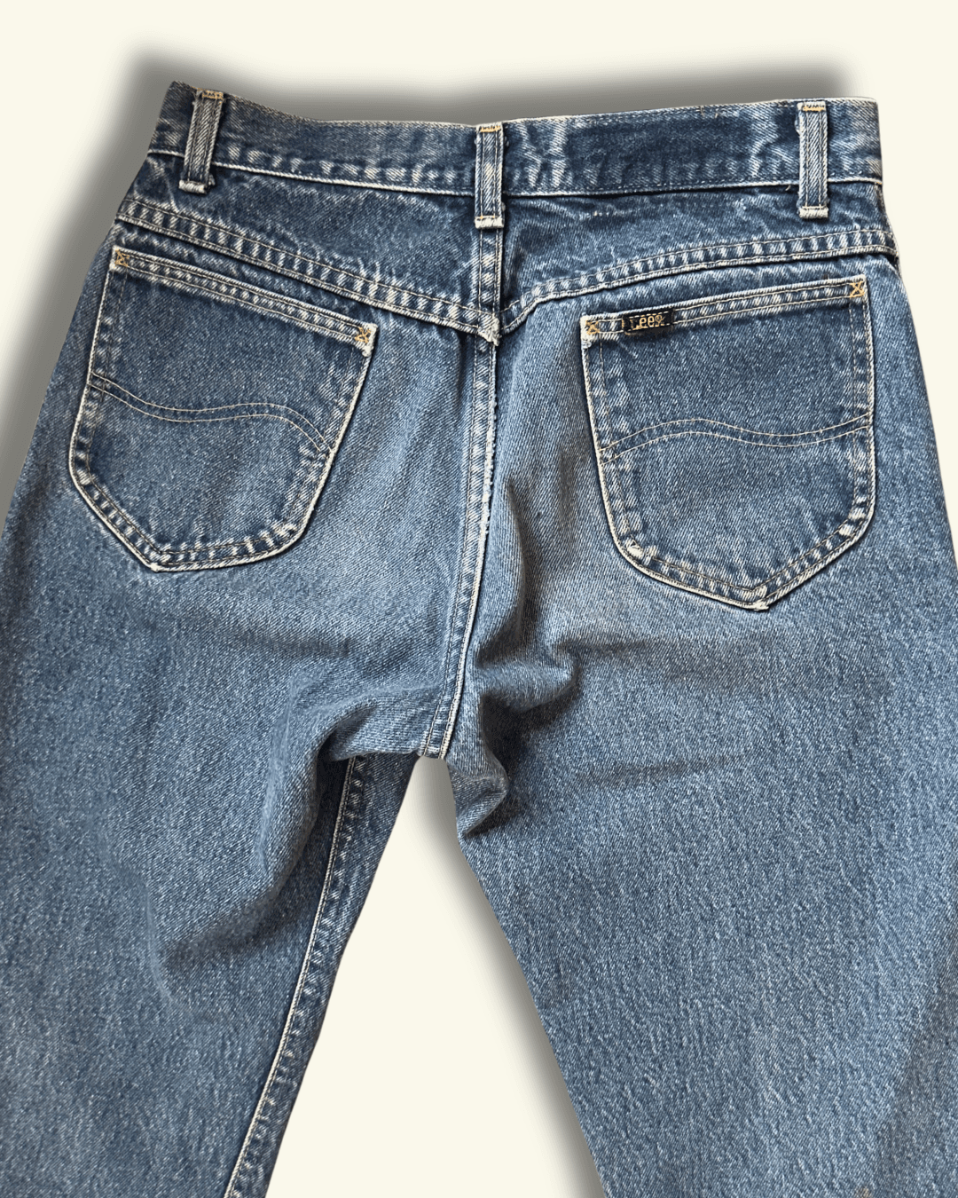 Paint-marked vintage Lee Riders medium-wash straight-leg jeans, model 200-0147, tagged 30 x 34