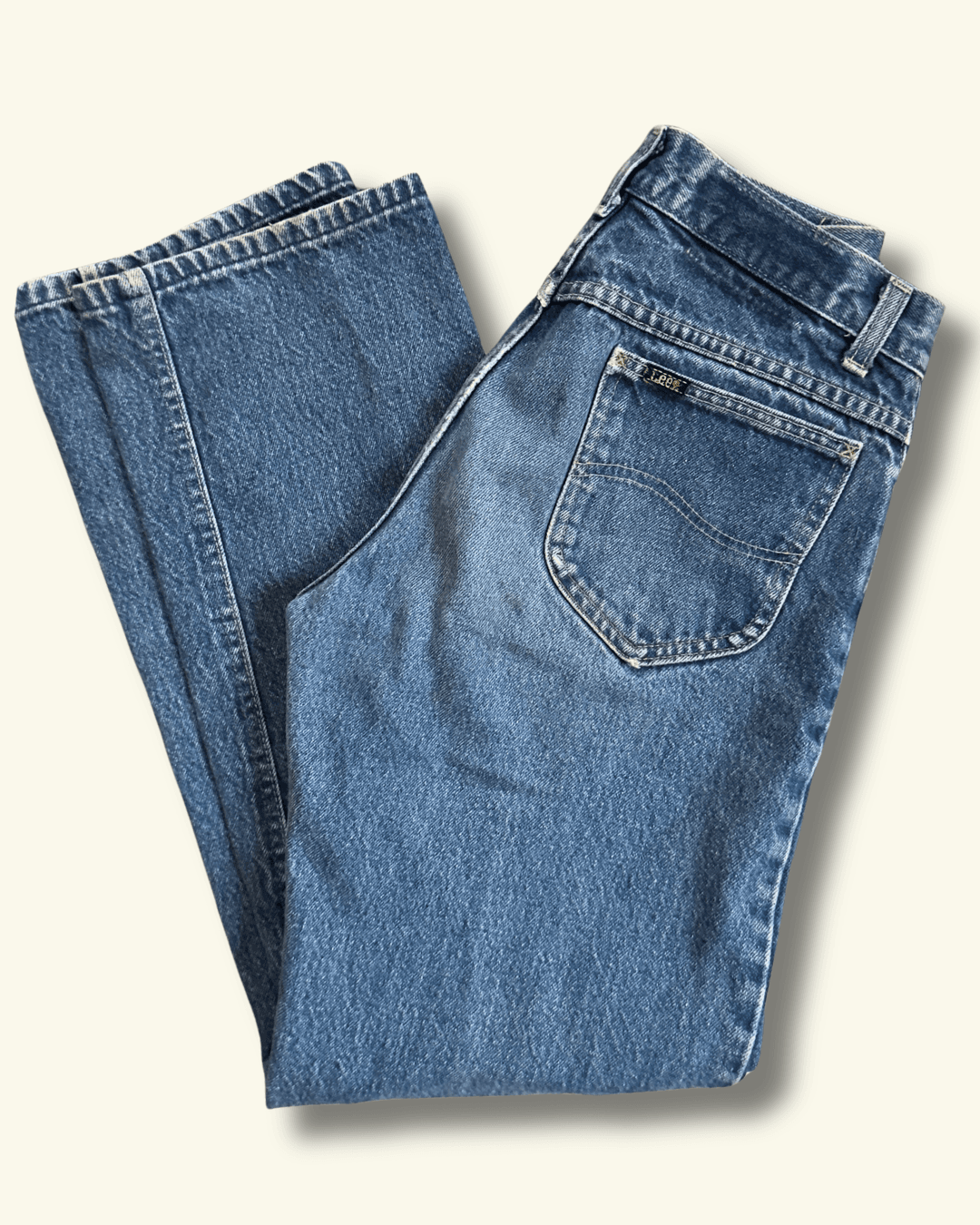 Paint-marked vintage Lee Riders medium-wash straight-leg jeans, model 200-0147, tagged 30 x 34