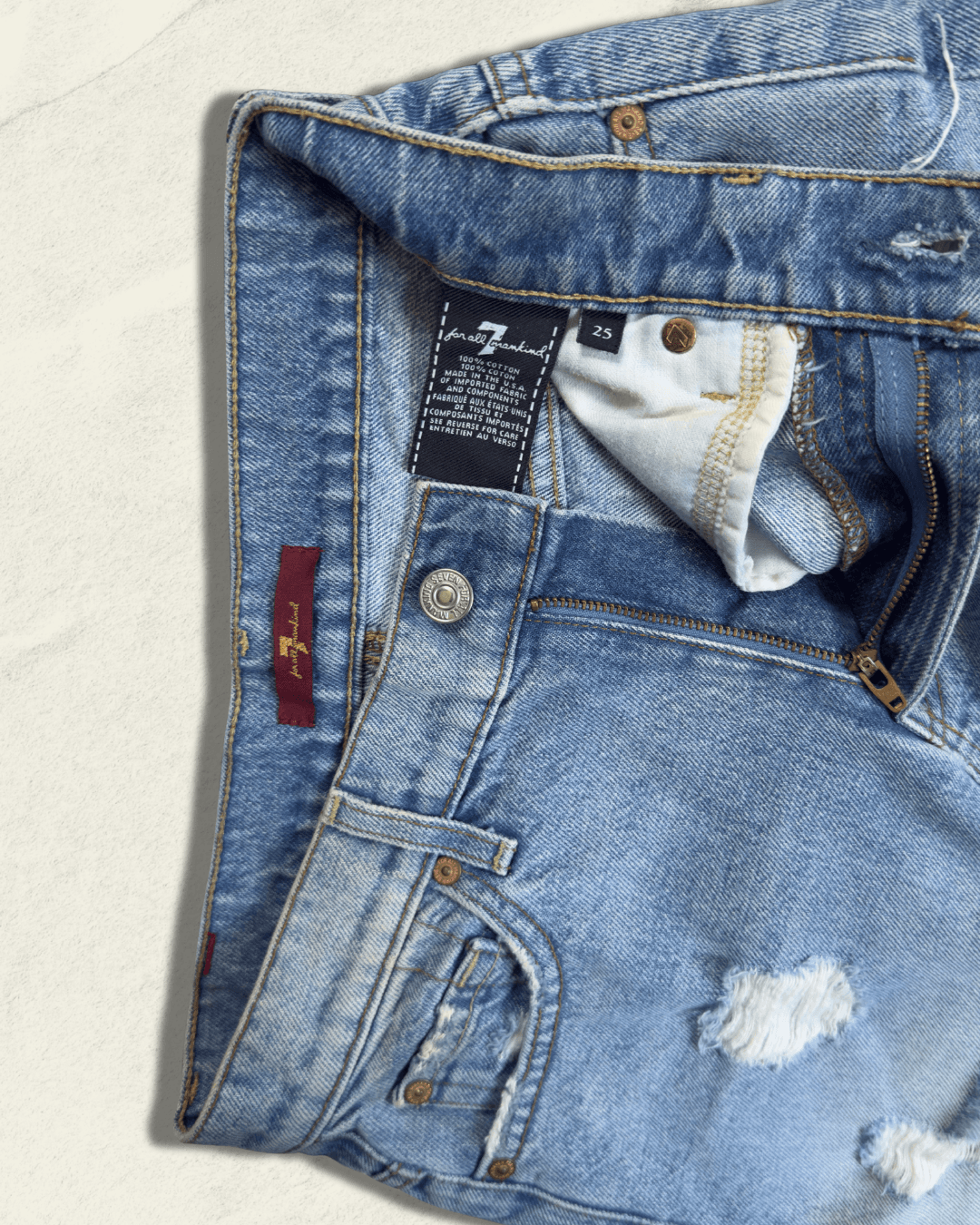 7 For All Mankind light-wash distressed denim mini skirt with raw fringed asymmetric hem, size 25
