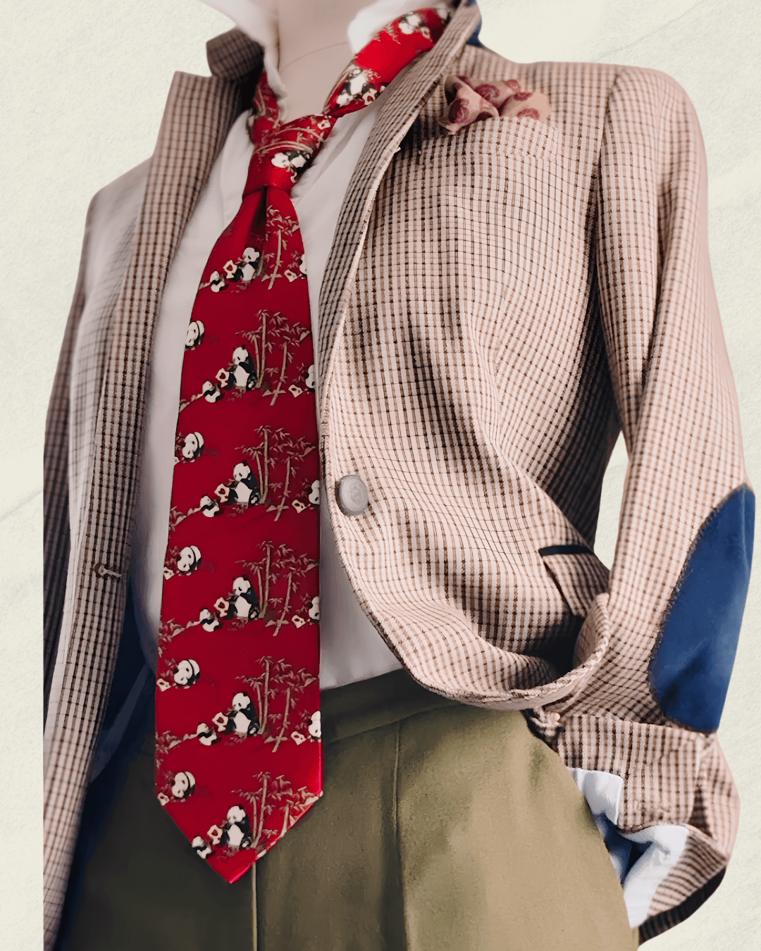 Vintage Giorgio Armani Cravatte tie in lacquer red, printed with pandas in a bamboo grove, styled over a white shirt and houndstooth jacket.