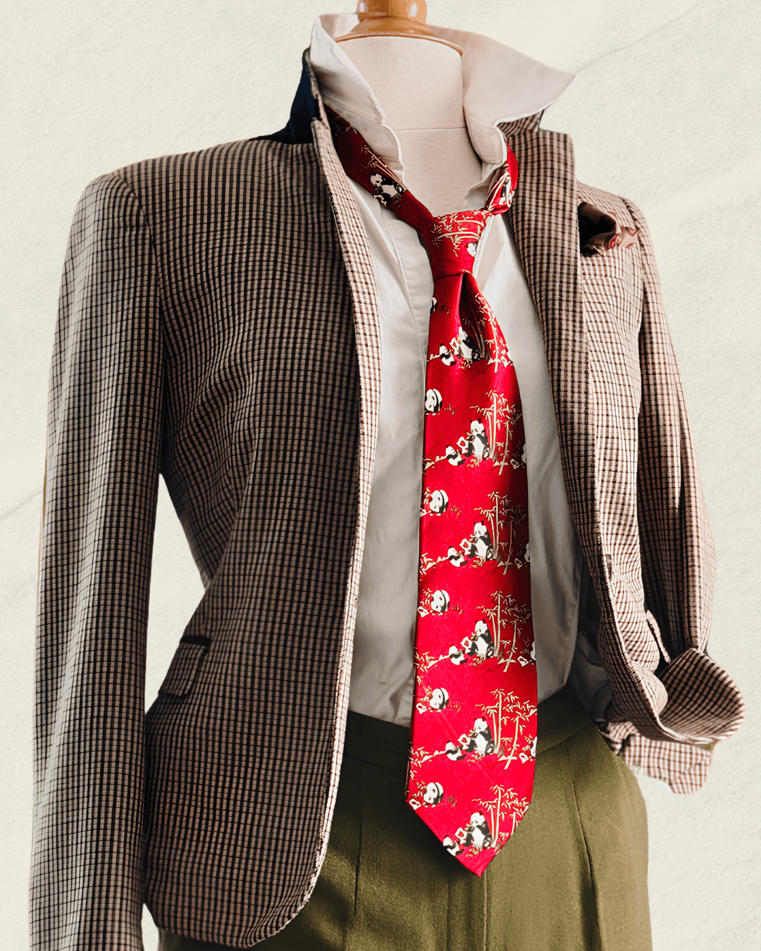 Vintage Giorgio Armani Cravatte tie in lacquer red, printed with pandas in a bamboo grove, styled over a white shirt and houndstooth jacket.